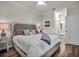 Bright bedroom featuring a comfortable queen bed, ceiling fan, and ensuite bathroom access at 17724 Gawthrop Dr # 402, Bradenton, FL 34211