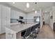 Spacious kitchen with an expansive island, modern appliances, and white cabinetry at 17724 Gawthrop Dr # 402, Bradenton, FL 34211