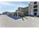 Community parking area with covered parking spaces and well maintained landscaping at 17724 Gawthrop Dr # 402, Bradenton, FL 34211