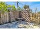 Backyard stone patio shaded by wood pergola with table, offering a private outdoor retreat at 1842 Oklahoma Ne Ave, St Petersburg, FL 33703