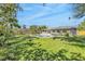 Backyard featuring a private in-ground swimming pool, patio, and lush lawn at 1842 Oklahoma Ne Ave, St Petersburg, FL 33703