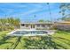Backyard oasis featuring a private in-ground swimming pool, patio, and well-manicured lawn at 1842 Oklahoma Ne Ave, St Petersburg, FL 33703