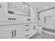 Modern bathroom featuring double vanity, sleek black fixtures, and glass-enclosed shower with stylish tile work at 1842 Oklahoma Ne Ave, St Petersburg, FL 33703