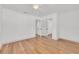 An airy bedroom featuring wood floors, a closet and white trim at 1842 Oklahoma Ne Ave, St Petersburg, FL 33703