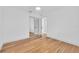 Bedroom with wood floors and closet with mirrored doors at 1842 Oklahoma Ne Ave, St Petersburg, FL 33703