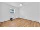 Bedroom with wood floors, a ceiling fan and a window at 1842 Oklahoma Ne Ave, St Petersburg, FL 33703