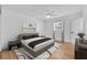 Staged bedroom with modern furnishings, a ceiling fan, and plenty of natural light at 1842 Oklahoma Ne Ave, St Petersburg, FL 33703