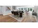 Dining room features a black table and chairs, a geometric accent wall, and an adjacent bar area at 1842 Oklahoma Ne Ave, St Petersburg, FL 33703