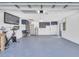 Spacious two-car garage featuring epoxy flooring and built-in storage cabinets at 1842 Oklahoma Ne Ave, St Petersburg, FL 33703