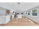 Open kitchen features white cabinets, stainless steel appliances, and lots of sunlight at 1842 Oklahoma Ne Ave, St Petersburg, FL 33703