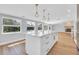 Kitchen island features pendant lighting and ample counter space for entertaining at 1842 Oklahoma Ne Ave, St Petersburg, FL 33703