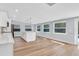 Kitchen island with seating is surrounded by natural light and outdoor views at 1842 Oklahoma Ne Ave, St Petersburg, FL 33703