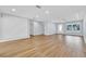 A bright, open living room with wood floors and direct access to other rooms at 1842 Oklahoma Ne Ave, St Petersburg, FL 33703