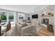 Bright living room features modern decor, fireplace, and sliding glass doors to the pool at 1842 Oklahoma Ne Ave, St Petersburg, FL 33703