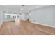 A bright and open floorplan with wood floors and access to the lanai at 1842 Oklahoma Ne Ave, St Petersburg, FL 33703