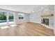 Bright living room features fireplace, ceiling fan, and sliding glass doors to the pool at 1842 Oklahoma Ne Ave, St Petersburg, FL 33703