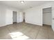 Neutral bedroom featuring tiled floors, closet and two entry points at 2106 20Th W St, Bradenton, FL 34205