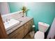 Bathroom featuring a granite countertop vanity, ample storage, and a coordinating toilet at 2504 Avenue B # A, Bradenton Beach, FL 34217