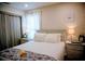 Cozy bedroom with soft lighting features ample storage and plush bedding for restful nights at 2504 Avenue B # A, Bradenton Beach, FL 34217