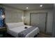 Relax in this inviting bedroom with stylish decor, soft lighting, and a comfortable bed at 2504 Avenue B # A, Bradenton Beach, FL 34217
