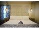 Comfortable bedroom featuring a decorative headboard, bedside tables, and soft lighting at 2504 Avenue B # A, Bradenton Beach, FL 34217