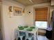 Eat-in kitchen dining area with table set for a small gathering at 2504 Avenue B # A, Bradenton Beach, FL 34217