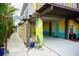 Unique tree house style home with covered parking and vibrant colors at 2504 Avenue B # A, Bradenton Beach, FL 34217
