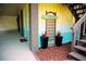 Charming Beach Shack featuring colorful exterior, potted plants, and stairs to a second level at 2504 Avenue B # A, Bradenton Beach, FL 34217