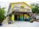 Colorful two-story home featuring a sun deck and bright, beachy accents at 2504 Avenue B # A, Bradenton Beach, FL 34217