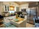 Bright kitchen features white cabinetry, mosaic backsplash, and stainless steel appliances at 2504 Avenue B # A, Bradenton Beach, FL 34217