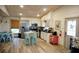 Open kitchen with stainless appliances, light wood floors, and eat in dining area at 2504 Avenue B # A, Bradenton Beach, FL 34217