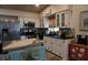 Bright kitchen with granite countertops, stainless steel appliances, and kitchen island at 2504 Avenue B # A, Bradenton Beach, FL 34217