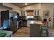 Bright kitchen with granite countertops, stainless steel appliances, and island seating at 2504 Avenue B # A, Bradenton Beach, FL 34217