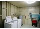 Functional laundry room with a washer, dryer, and water heater, offering convenience and storage at 2504 Avenue B # A, Bradenton Beach, FL 34217