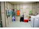 Functional laundry room with washer, dryer, and ample storage space for beach essentials at 2504 Avenue B # A, Bradenton Beach, FL 34217