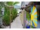 Unique tropical property entrance with lush greenery and beachy decor at 2504 Avenue B # A, Bradenton Beach, FL 34217