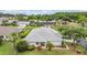 Aerial view highlighting the well-manicured lawn with tropical landscaping surrounding the single-Gathering home at 29312 Marker Loop, San Antonio, FL 33576