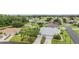 An aerial view showcases a well-maintained single-Gathering home with lush landscaping and a peaceful neighborhood setting at 29312 Marker Loop, San Antonio, FL 33576