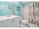 Bright bathroom with a double sink vanity, tub, shower, and coordinated decor at 29312 Marker Loop, San Antonio, FL 33576