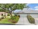Lovely one-story home with a two car garage, and a beautifully landscaped front yard at 29312 Marker Loop, San Antonio, FL 33576