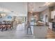 Open-concept living space featuring tile floors, a modern kitchen, and a bright living room at 29312 Marker Loop, San Antonio, FL 33576