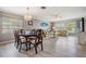 Inviting living space with a dining area, light-colored walls, and ample natural light, creating a warm atmosphere at 29312 Marker Loop, San Antonio, FL 33576