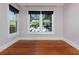 Bedroom featuring refinished wood floors, natural light, and neutral paint at 3000 4Th N Ave, St Petersburg, FL 33713