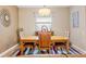 Spacious dining room with stylish chandelier and decorative mirror at 313 Old Windsor Way, Spring Hill, FL 34609