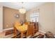 Dining room with a wood table and a decorative area rug at 313 Old Windsor Way, Spring Hill, FL 34609