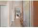 Welcoming foyer with tile flooring, an arched doorway, and a glimpse into the beautifully decorated living spaces at 313 Old Windsor Way, Spring Hill, FL 34609