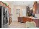 Modern kitchen featuring stainless steel appliances and granite countertops at 313 Old Windsor Way, Spring Hill, FL 34609