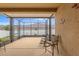 Screened patio with comfortable seating, perfect for outdoor relaxation and entertainment at 313 Old Windsor Way, Spring Hill, FL 34609