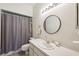 Cozy bathroom featuring a shower, vanity, and a well-lit mirror at 3350 Mermoor Dr # 1201, Palm Harbor, FL 34685