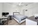 Clean bedroom with a modern bed, desk and natural lighting at 3350 Mermoor Dr # 1201, Palm Harbor, FL 34685